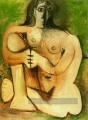 Femme accroupie nue sur fond vert 1960 cubiste Pablo Picasso